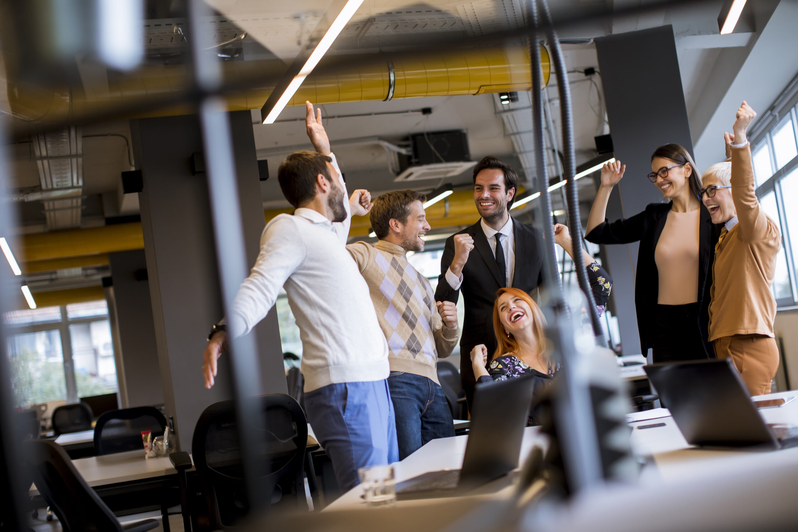 group of people celebrating marketing wins